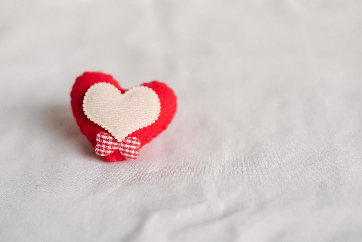 Love hearts on cotton texture background. Valentines day card concept. Heart for Valentines Day Background. photo