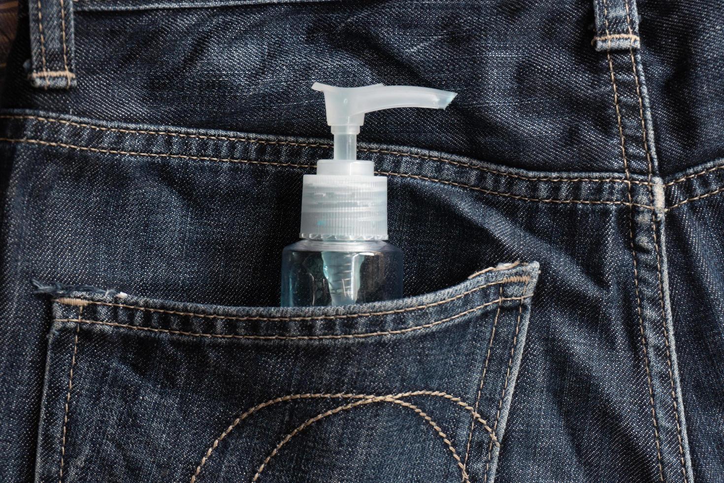 Anti-coronavirus spray. A man Carry it in the pant pocket photo