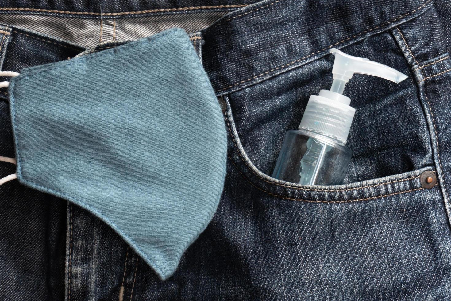 Anti-coronavirus spray. A man Carry it in the pant pocket photo