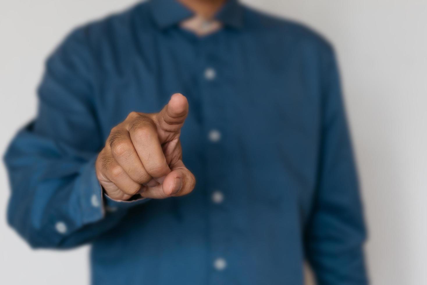 Young handsome man wearing light blue shirt with different behaviors at work photo