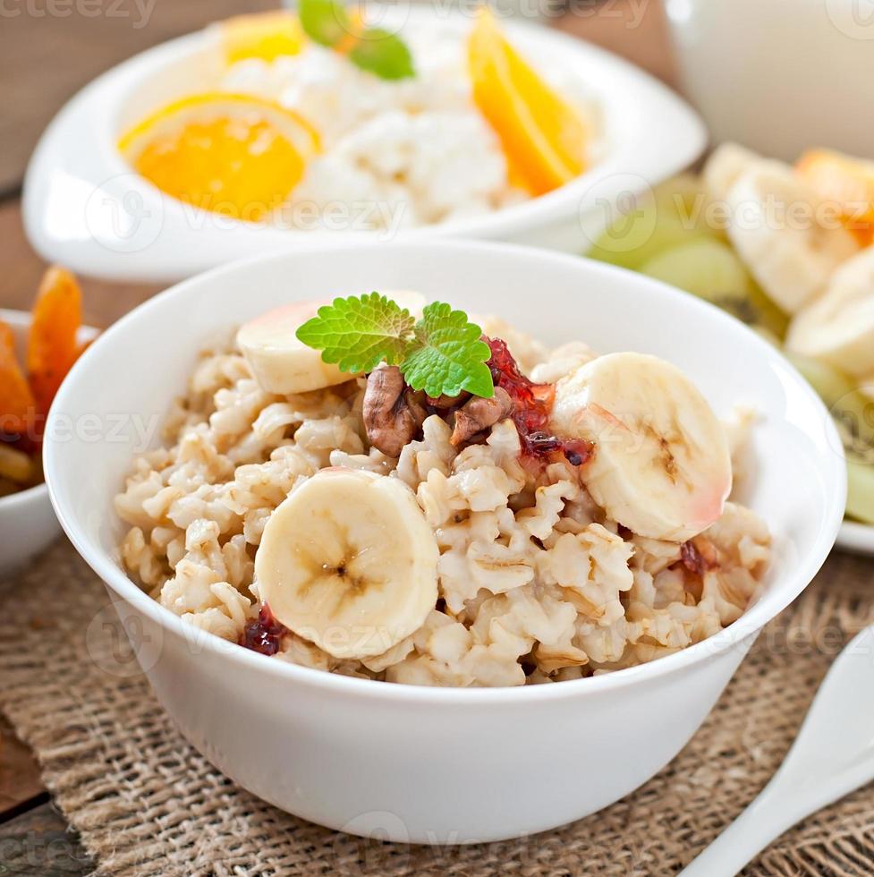 Healthy breakfast - oatmeal, cottage cheese, milk and fruit photo