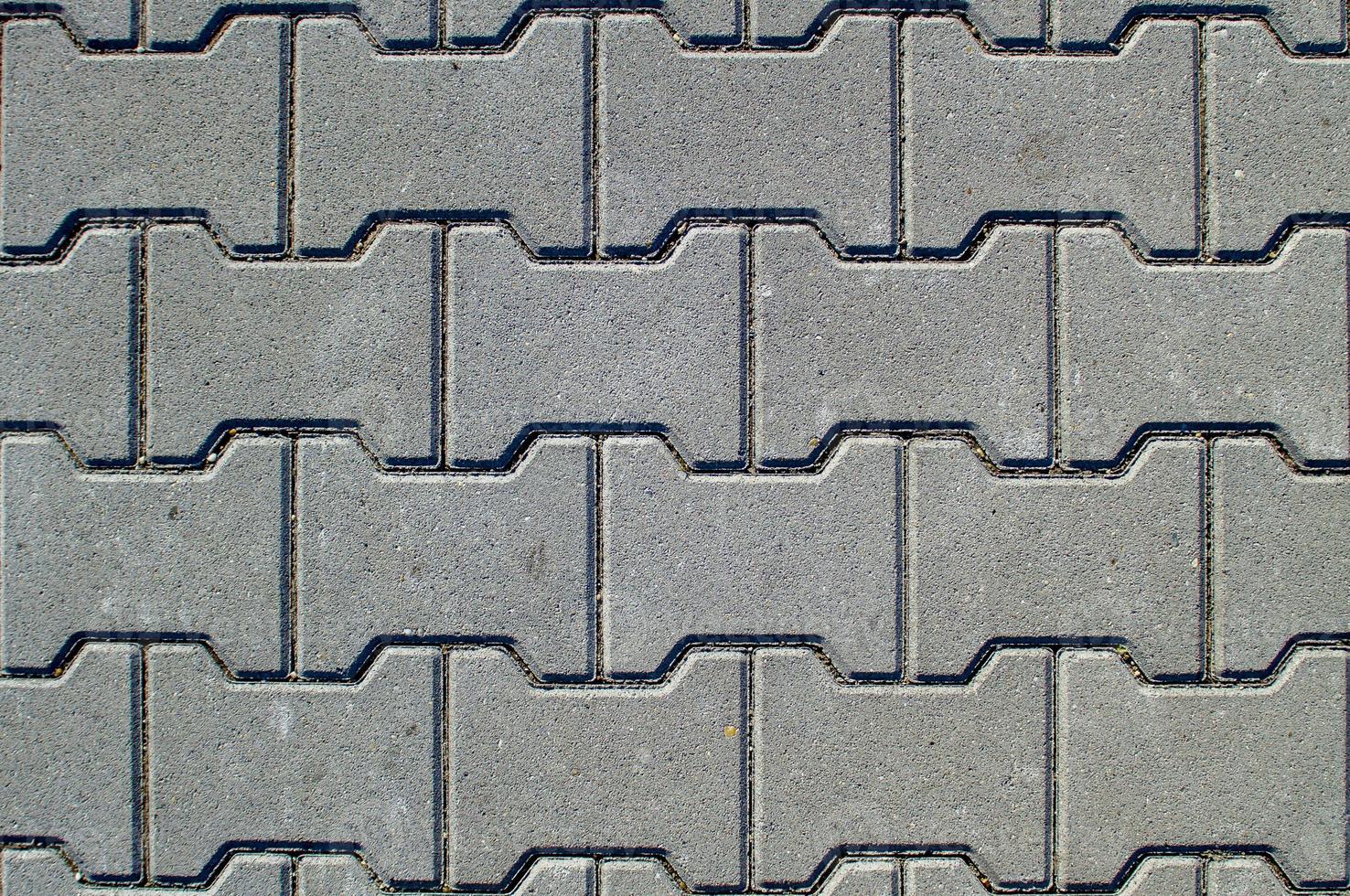 Texture of concrete pavement or sidewalk with paving slabs photo