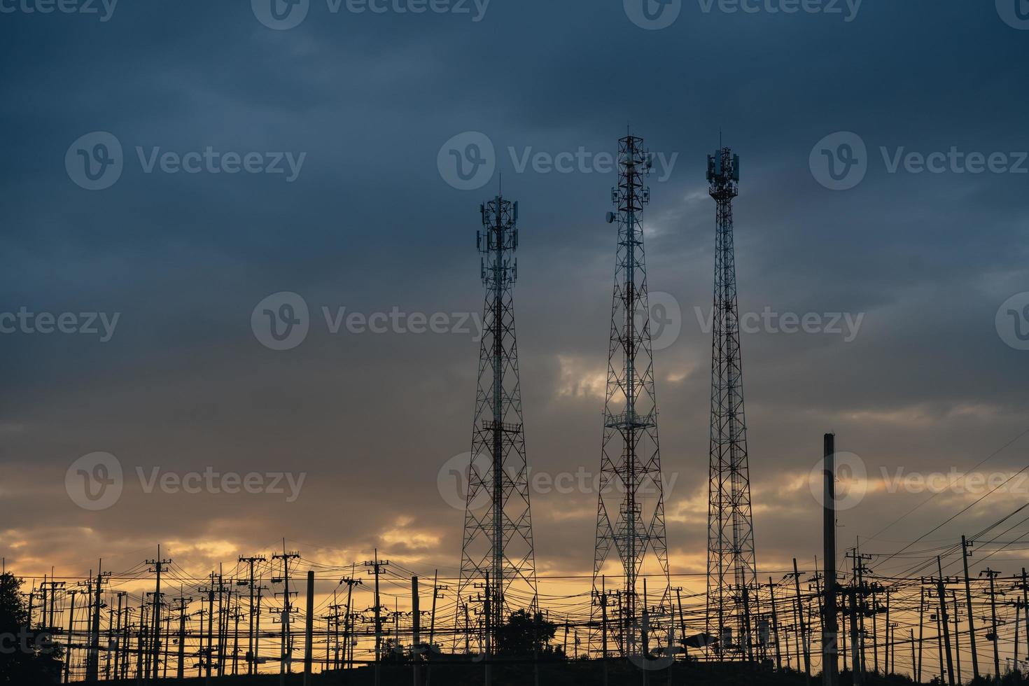 high voltage post.High voltage tower at power plant sunset evening golden time  sky background photo