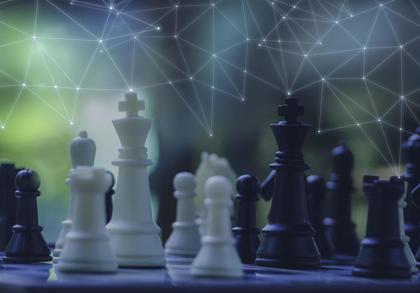 Black and White King and Knight of chess battle on board . Black king are leader to fight with teamwork to victory. Leader and teamwork concept for success. Competition and defeating concept photo