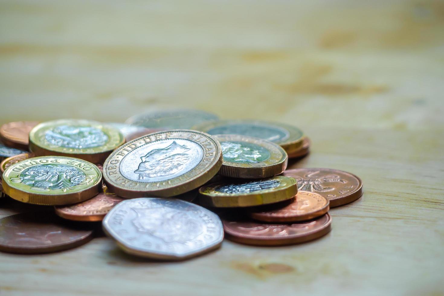 Coins stack on wood table. Concept for loan, property ladder, financial, mortgage, real estate investment, taxes and bonus. photo