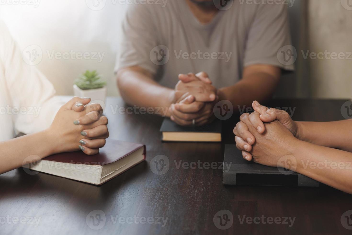 Asian Christian groups sitting within the Church Catholic prayed for blessings from God. A pale sun shone in a place of worship.Religious concepts. photo