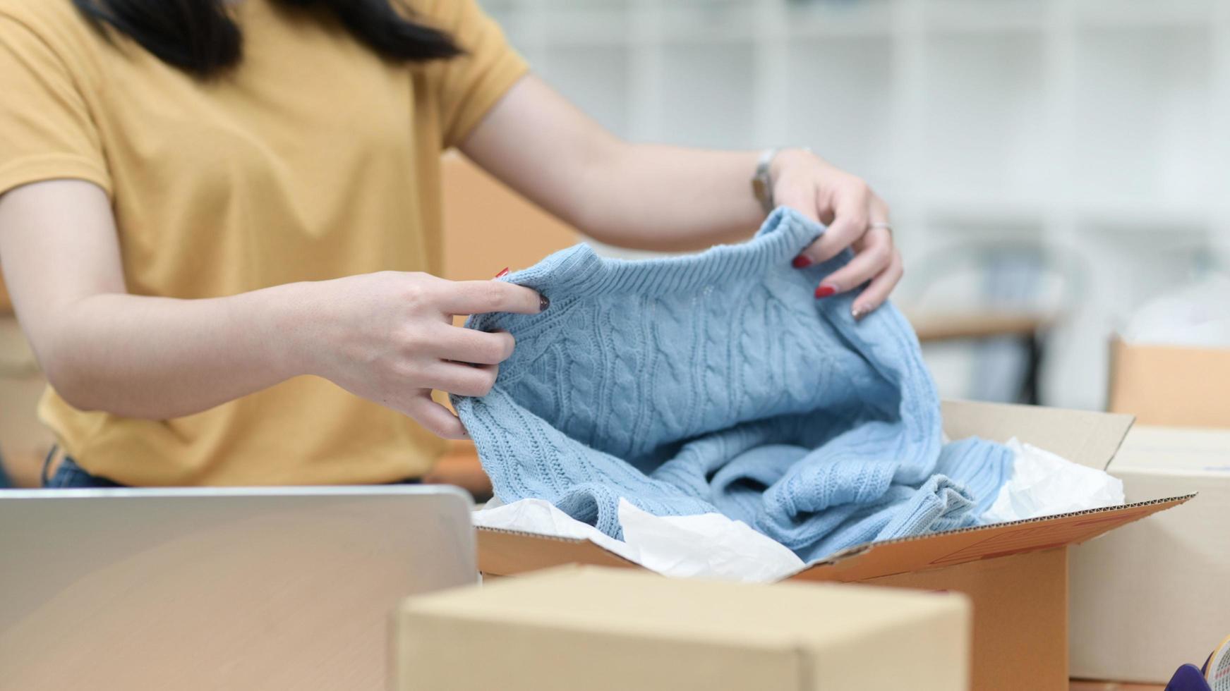 Selling products online, packing, shipping parcels, online marketing. photo