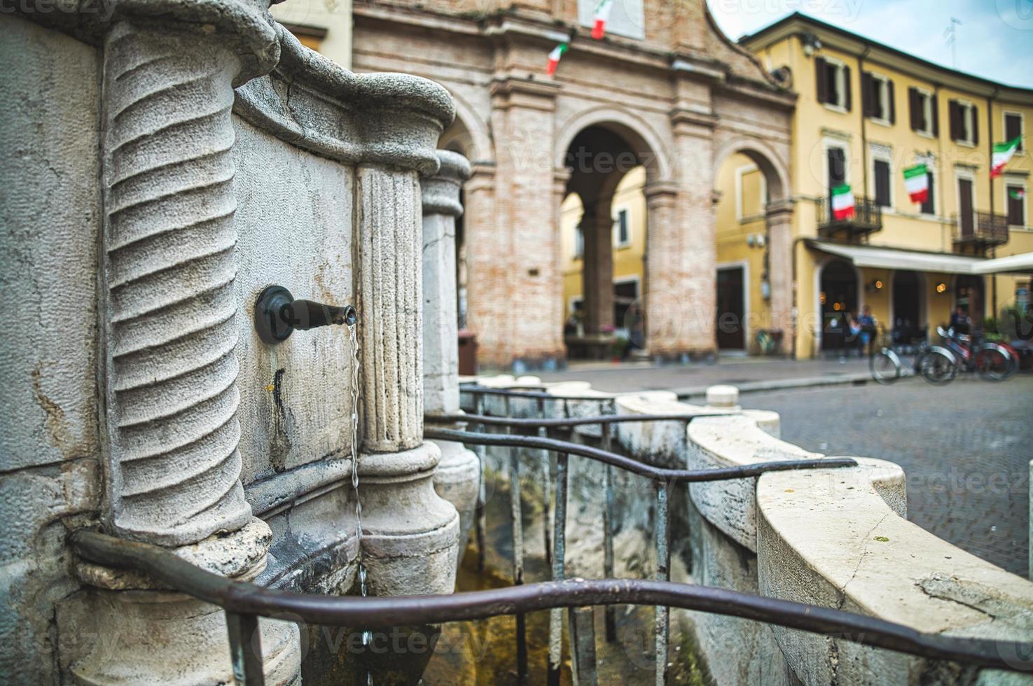 Detail of the Pigna fountain in  Cavour Square in Rimini Italy photo