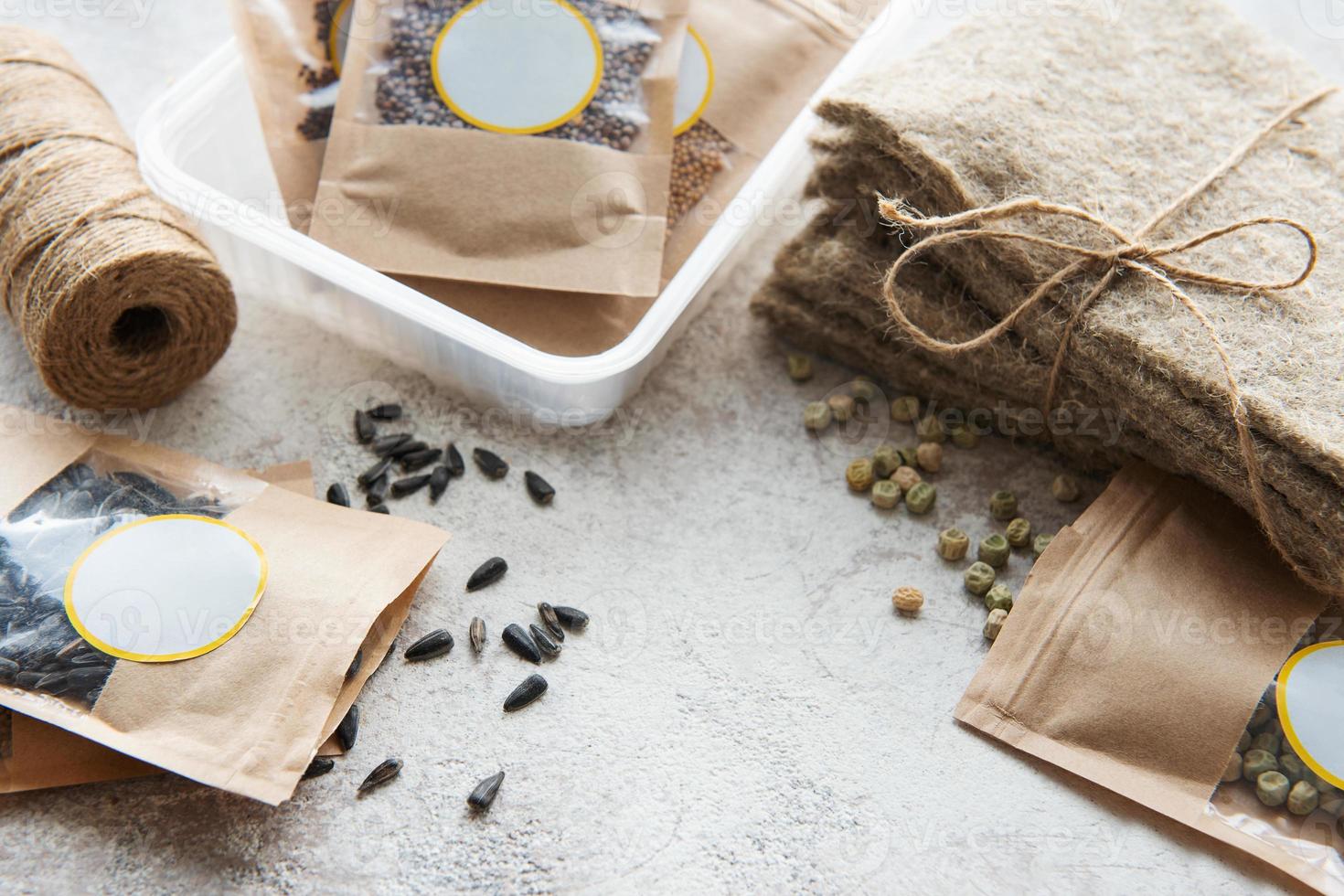 Microgreen seeds in paper bags and equipment for sowing microgreens. photo