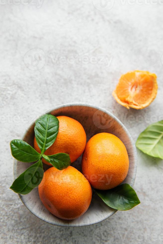 Fresh citrus fruits tangerines, oranges photo