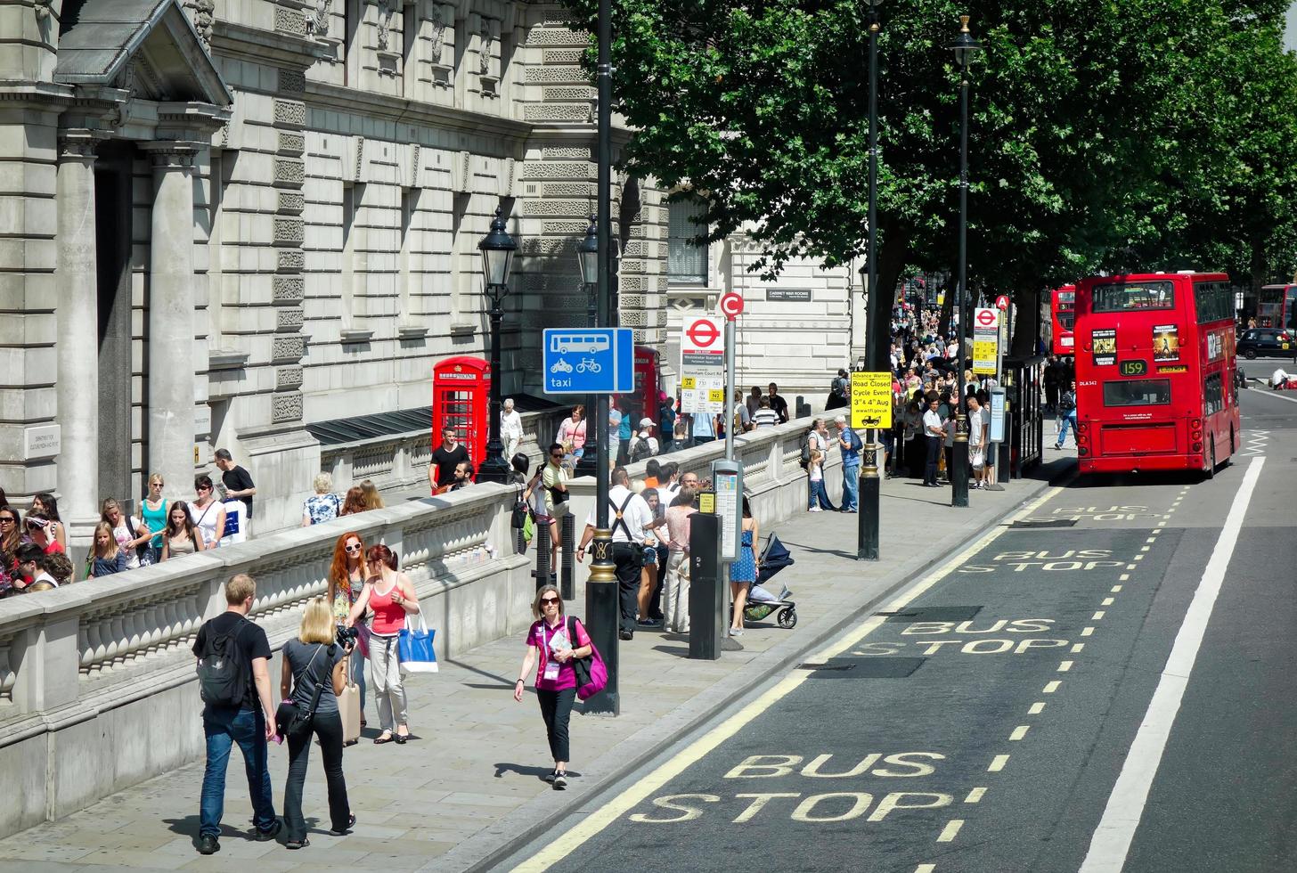 People Walking along Horse Guards Road in London on July 27, 2013. Unidentified people. photo