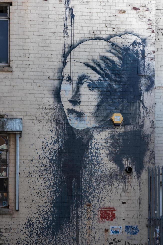 Woman's portrait Graffiti on a wall  in Bristol on May 14, 2019 photo