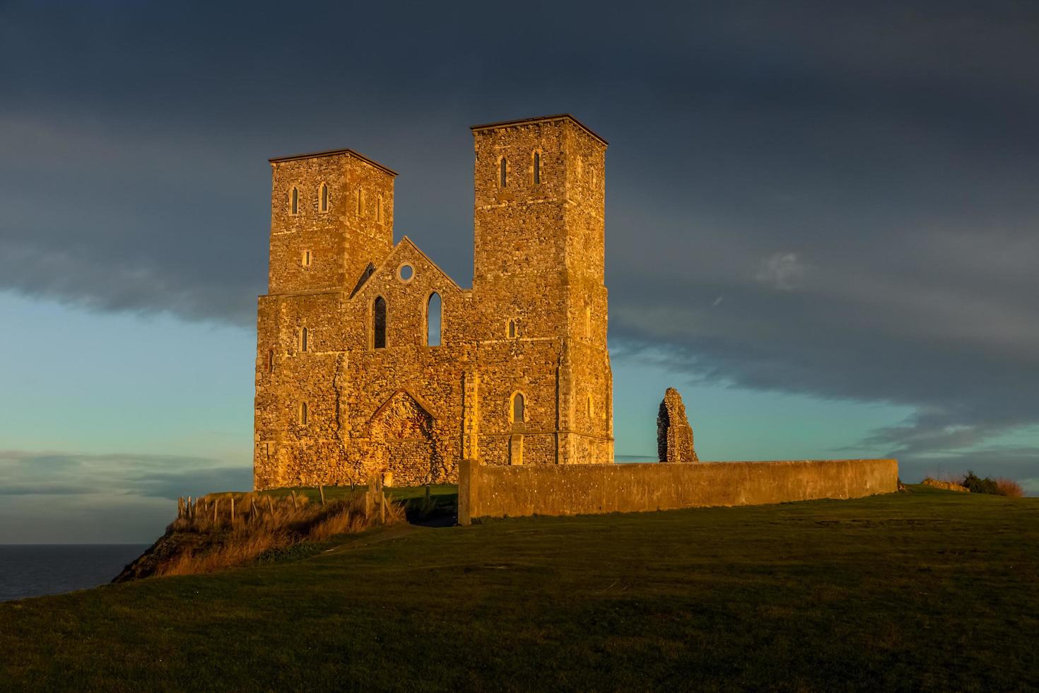 Remains of Reculver Church Towers Bathed in Late Afternoon Sun in Winter at Reculver in Kent on December 10, 2008 photo