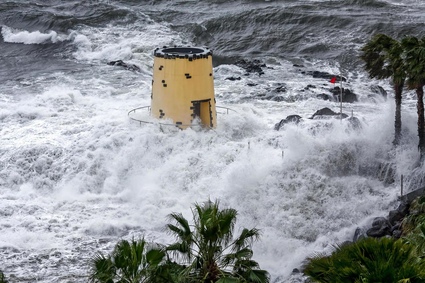 Tropical storm hitting the lookout tower in the grounds of the Savoy Hotel Funchal Madeira on April 9, 2008 photo