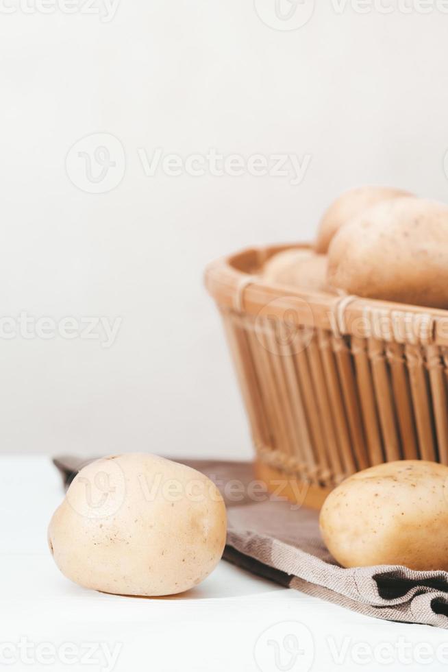 close up view of potatoes fresh grown and harvested. vertical shot, copy space. photo