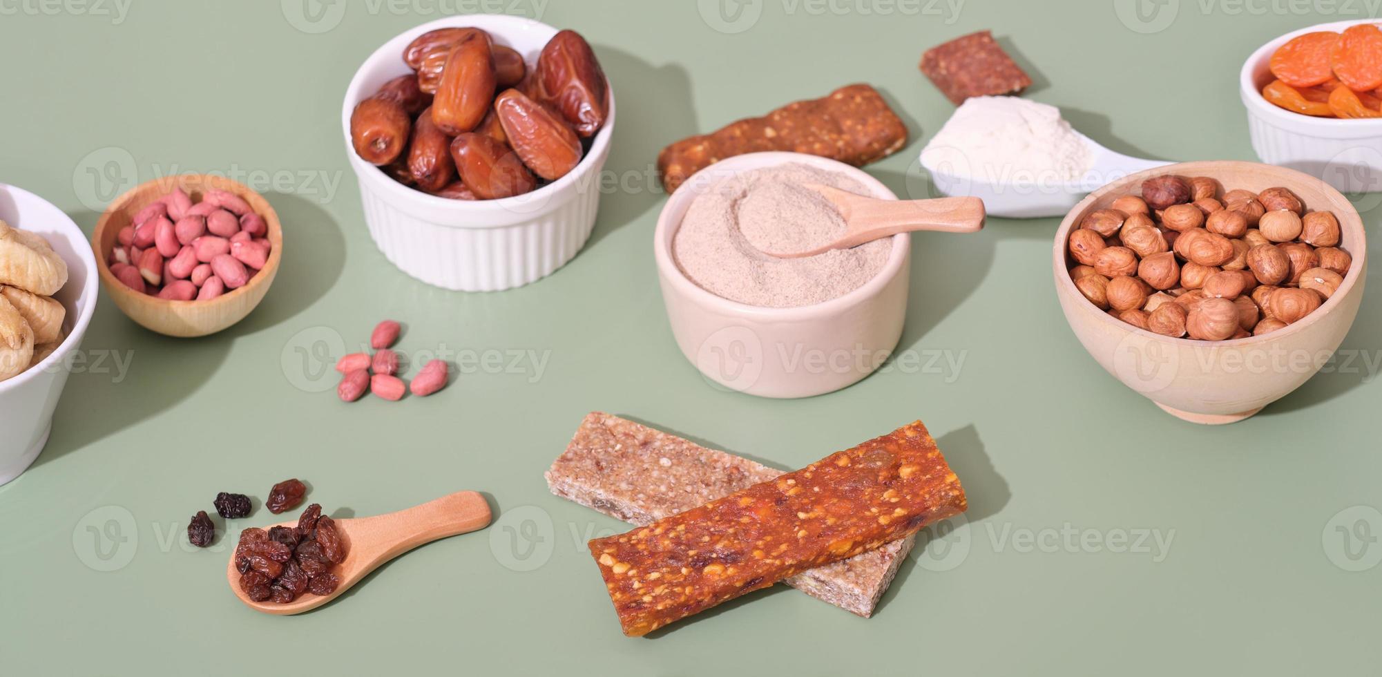 Mixed nuts and dried fruits in a wooden bowls. A healthy snack is a mix of organic nuts and dried fruits, paleo energy bars photo