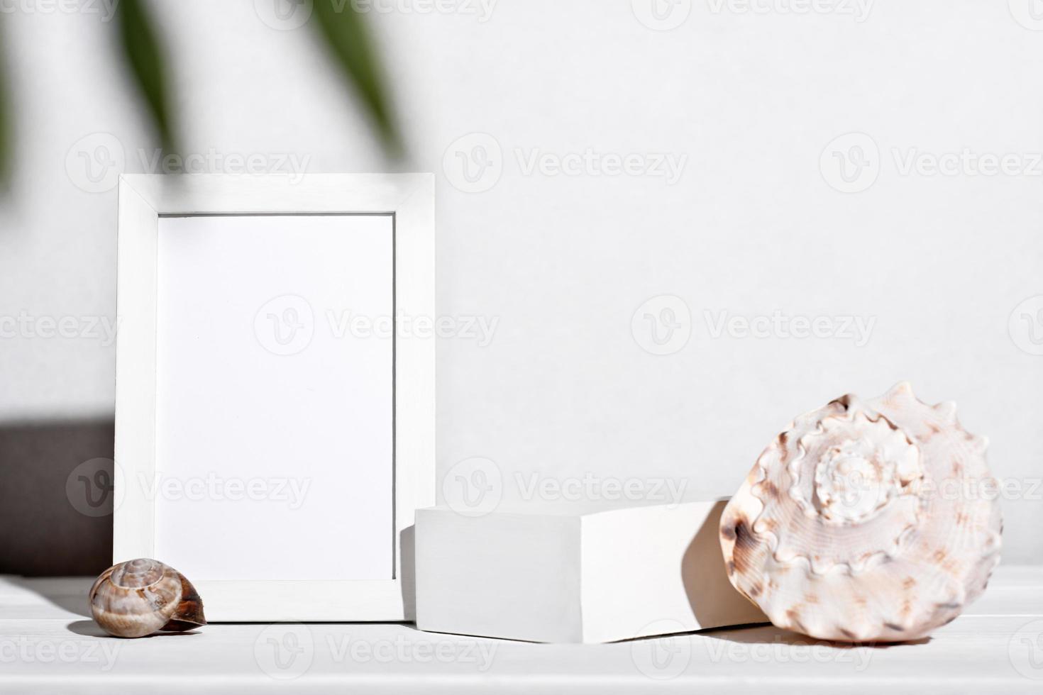 summer holiday mockup, tropical vacation and sea travel. white frame and seashells next to white podium or pedestal for product placement. display showcase mockup. photo