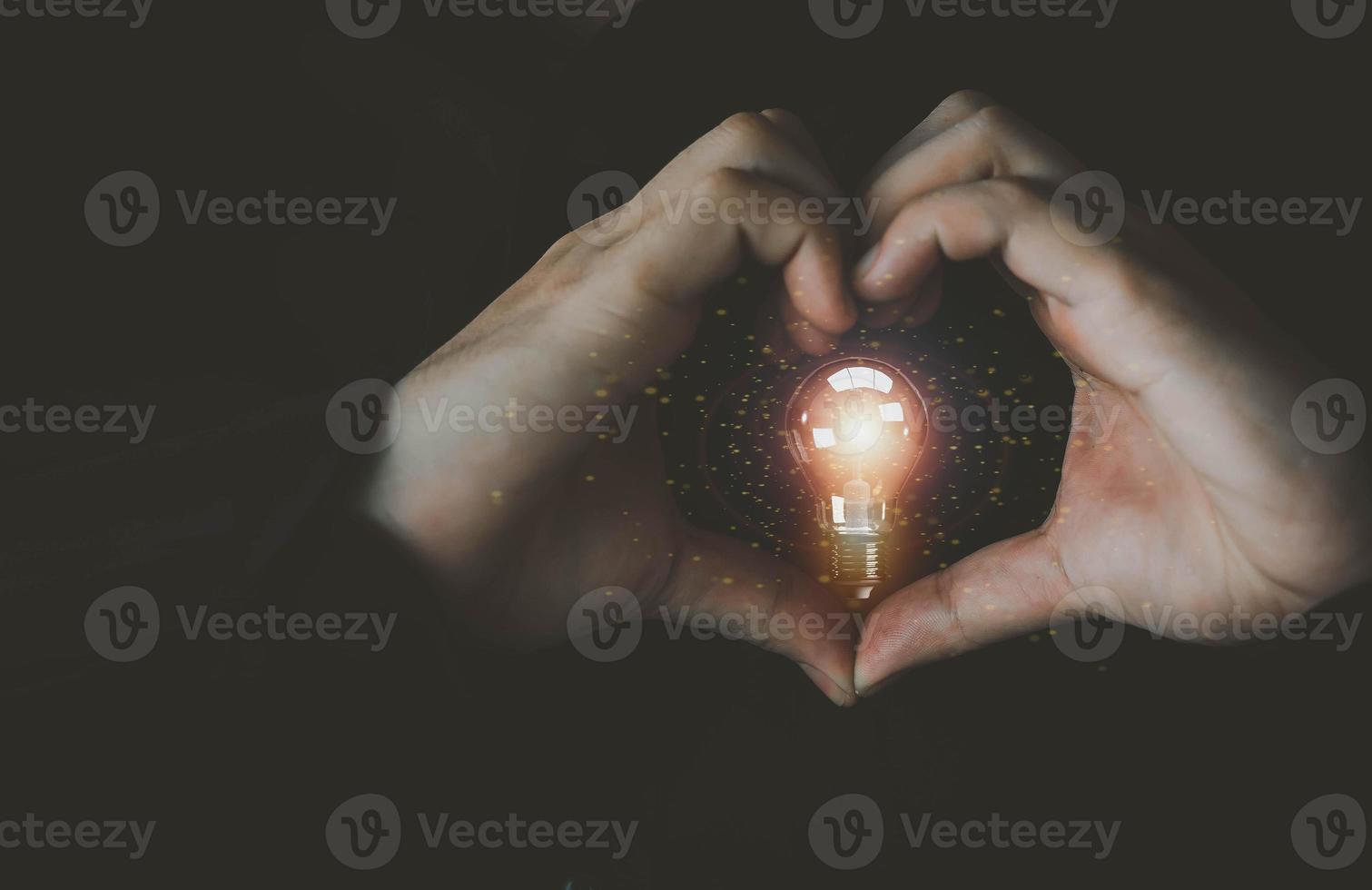 Finger hand heart love lightbulb lamp electric energy power glowing symbol business strategy intelligence planning creative idea vision brainstorm inspiration knowledge financial marketing.3d render photo