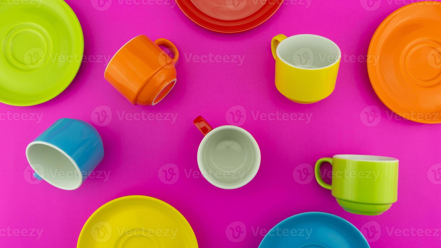 Colorful coffee cup on colorful paper background A lot of cups for coffee and tea in coffee shop Food and drink background concept photo