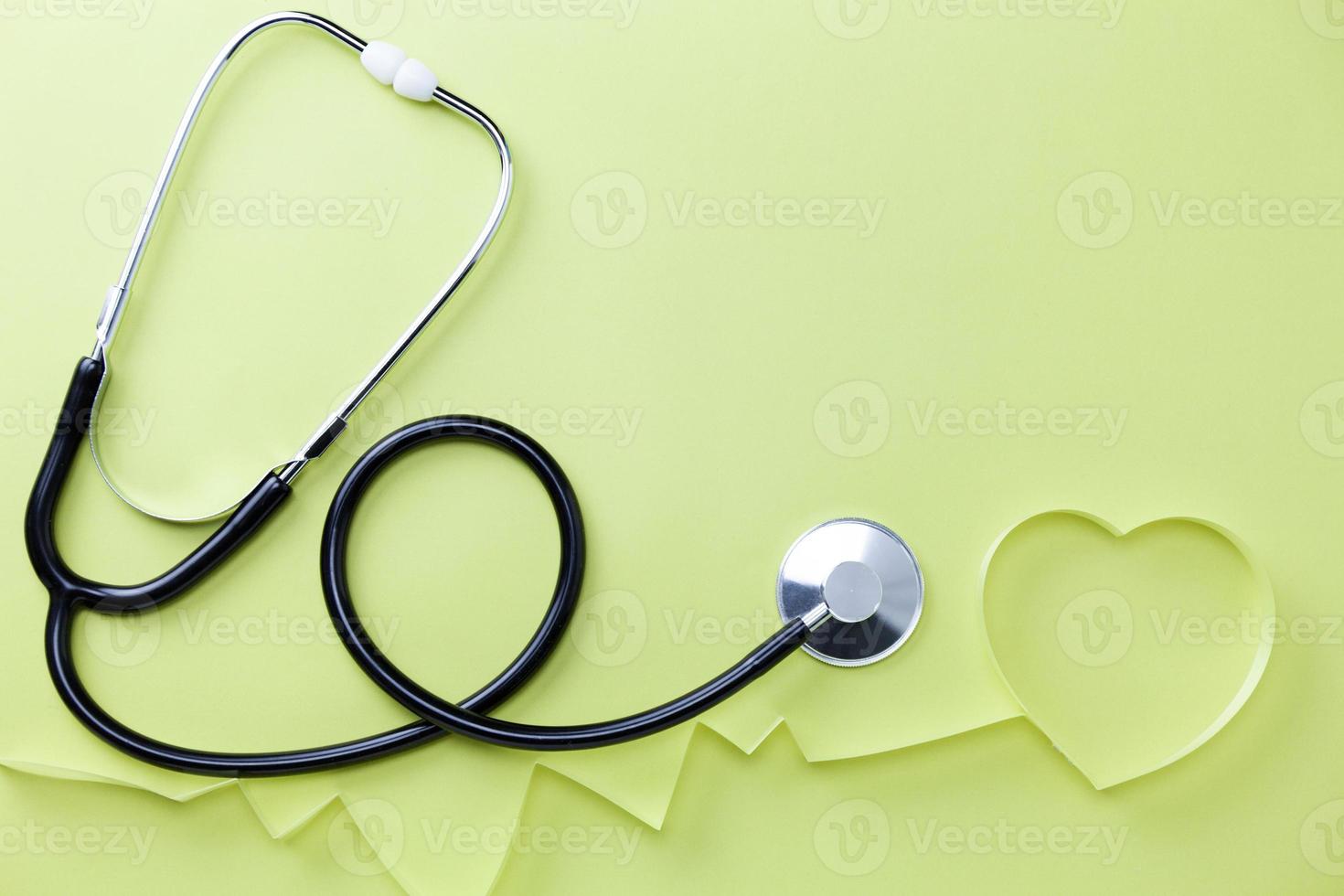 World heart day banner background Medical stethoscope and Heart symbol on table background Medical concept photo