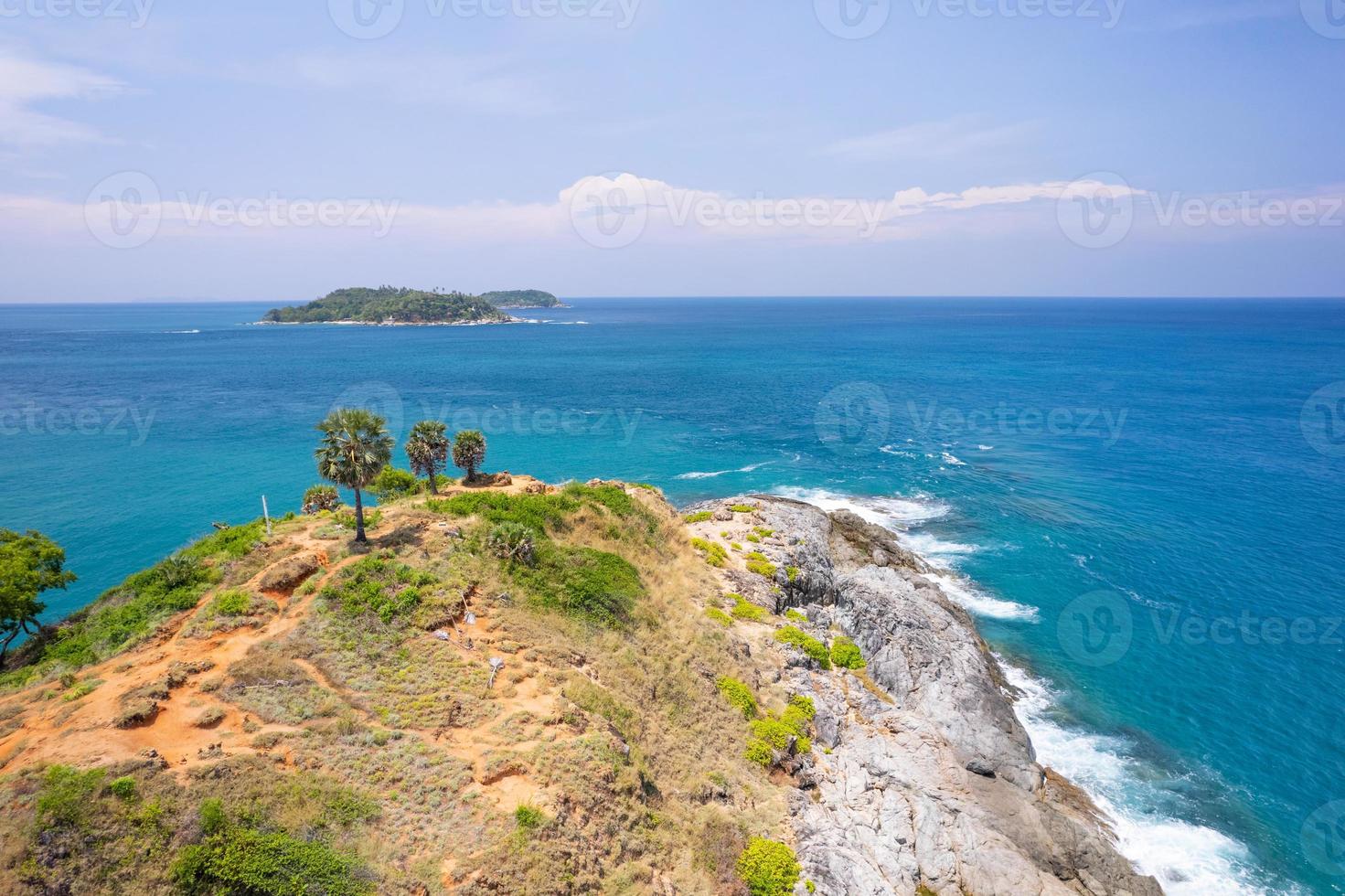Aerial view phuket seashore Wave crashing on rocks at Laem promthep cape beautiful sea in Phuket Thailand.Phuket view point is famous tourist destination at Thailand photo
