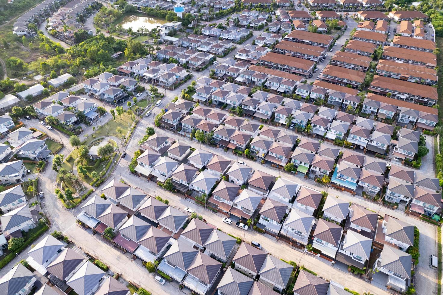 New development real estate. Aerial view of residential houses and driveways neighborhood during a fall sunset or sunrise time.Tightly packed homes.Top down view over private houses in phuket thailand photo