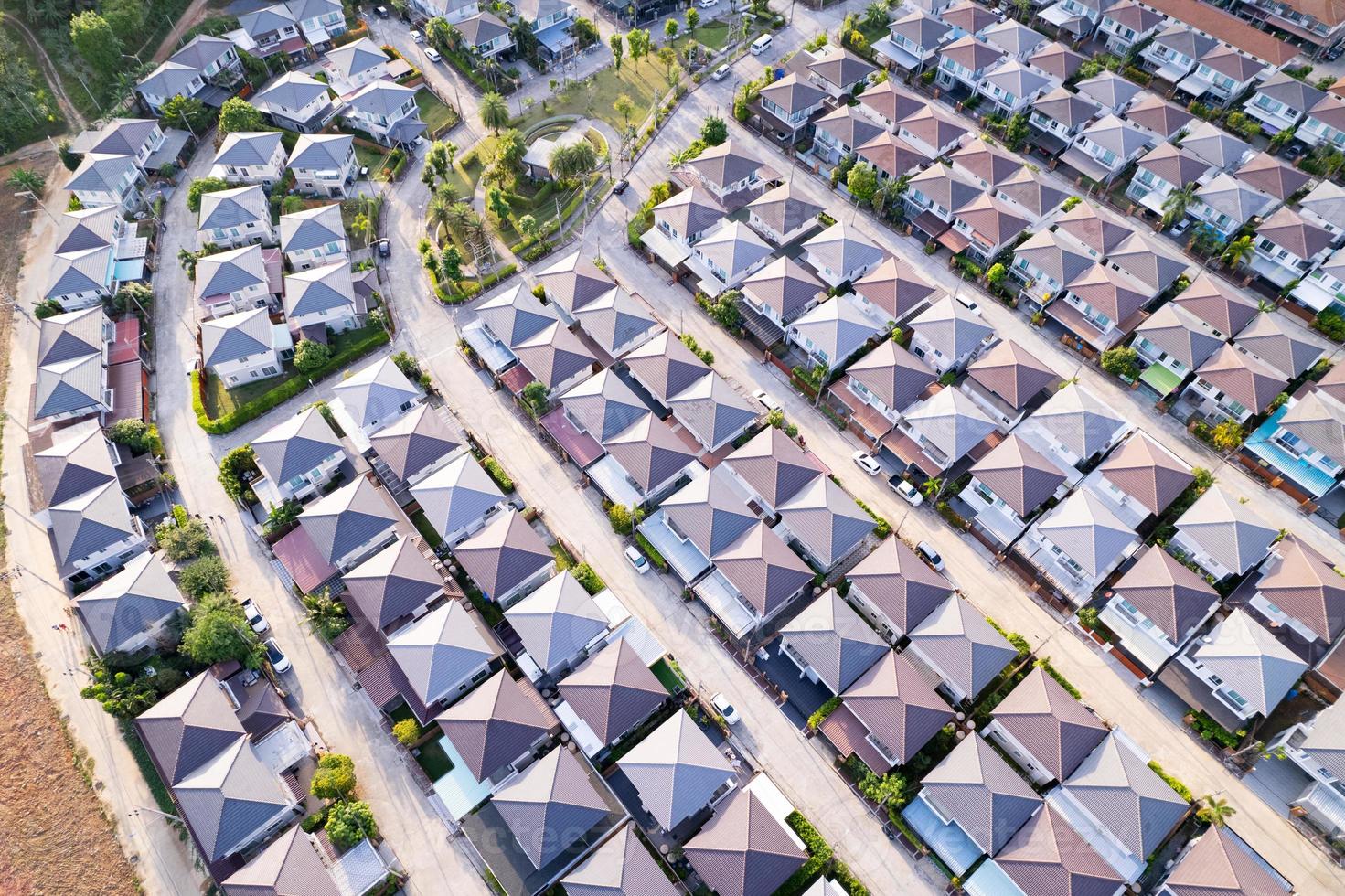New development real estate. Aerial view of residential houses and driveways neighborhood during a fall sunset or sunrise time.Tightly packed homes.Top down view over private houses in phuket thailand photo
