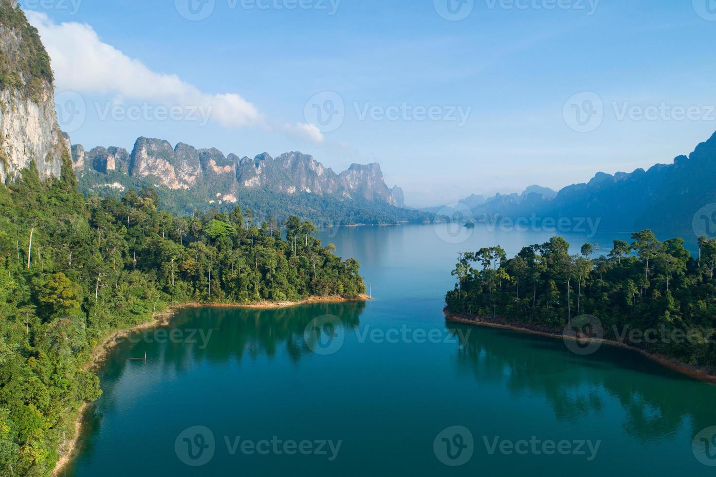 Aerial drone view of tropical Mountain peak in Thailand Beautiful archipelago islands Thailand Scenic mountains on the lake in Khao Sok National Park amazing nature landscape photo