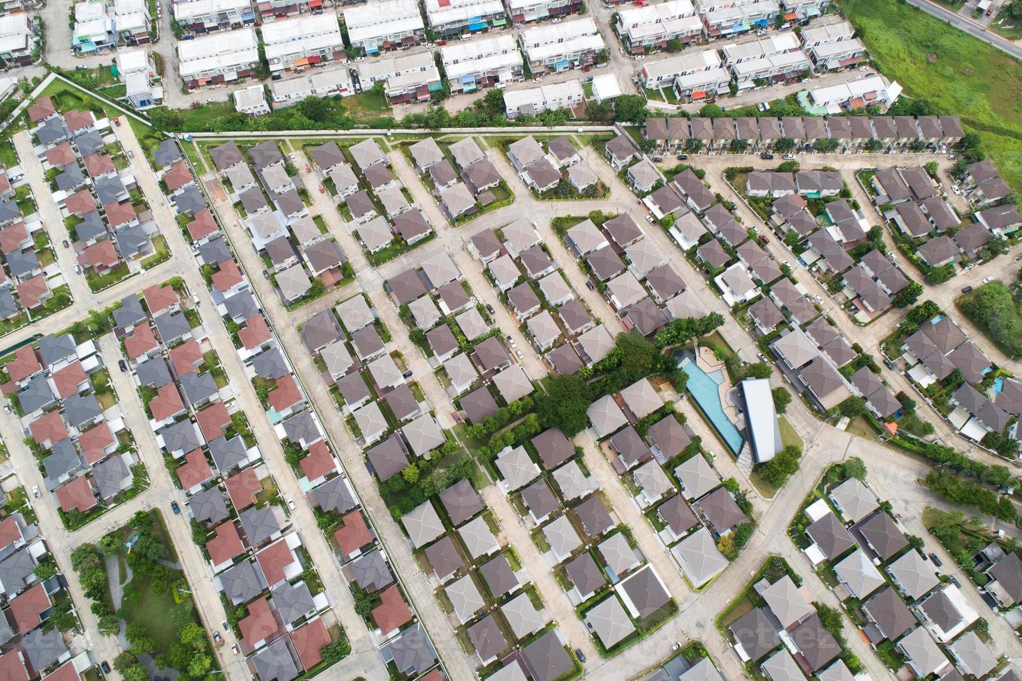 New development real estate. Aerial view of residential houses and driveways neighborhood during a fall sunset or sunrise time. Tightly packed homes. Top view over private houses in phuket thailand photo