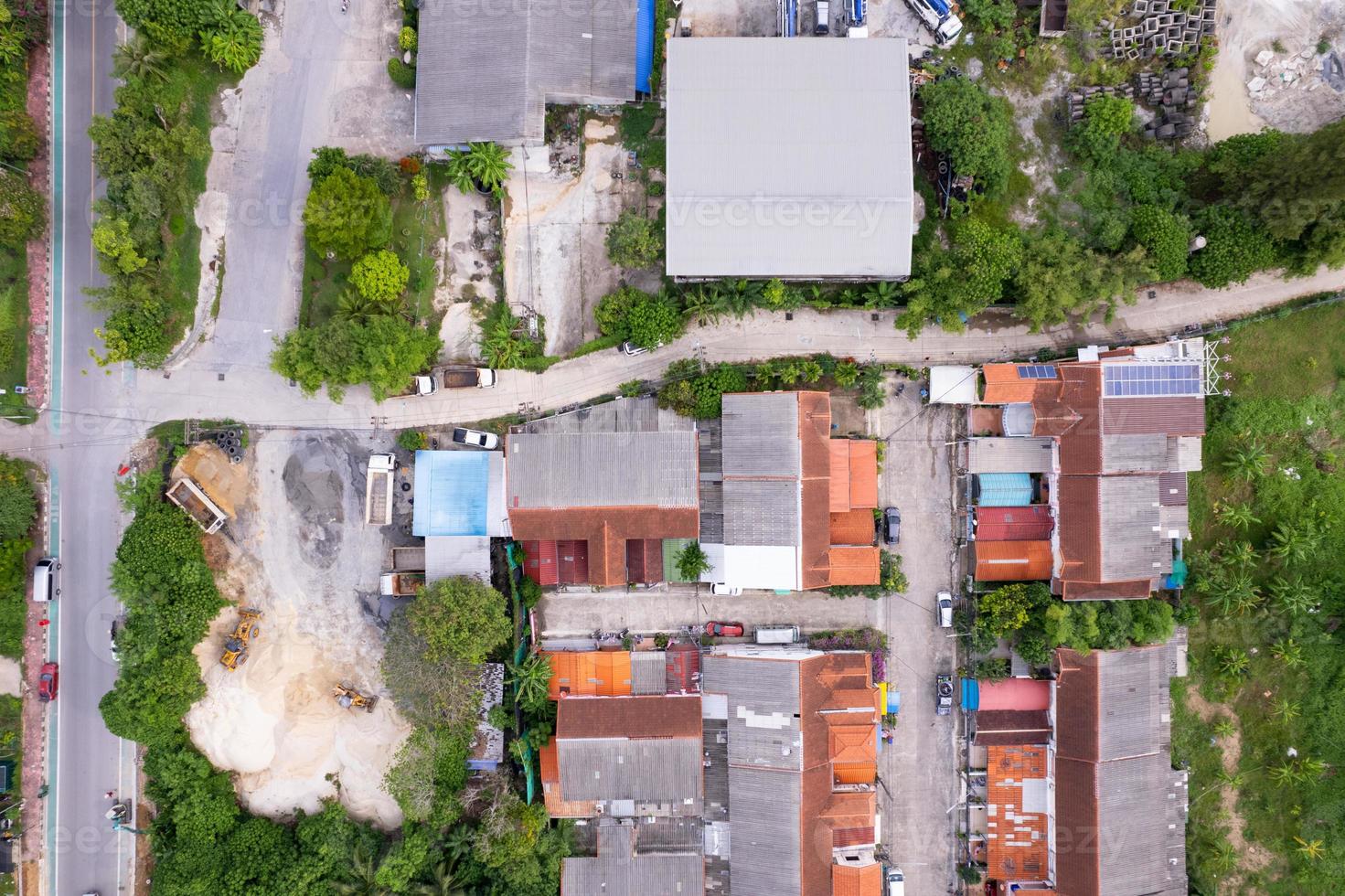 Development real estate. Aerial view of residential houses and driveways neighborhood during a fall sunset or sunrise time.Tightly packed homes.Top down view over private houses in phuket thailand photo