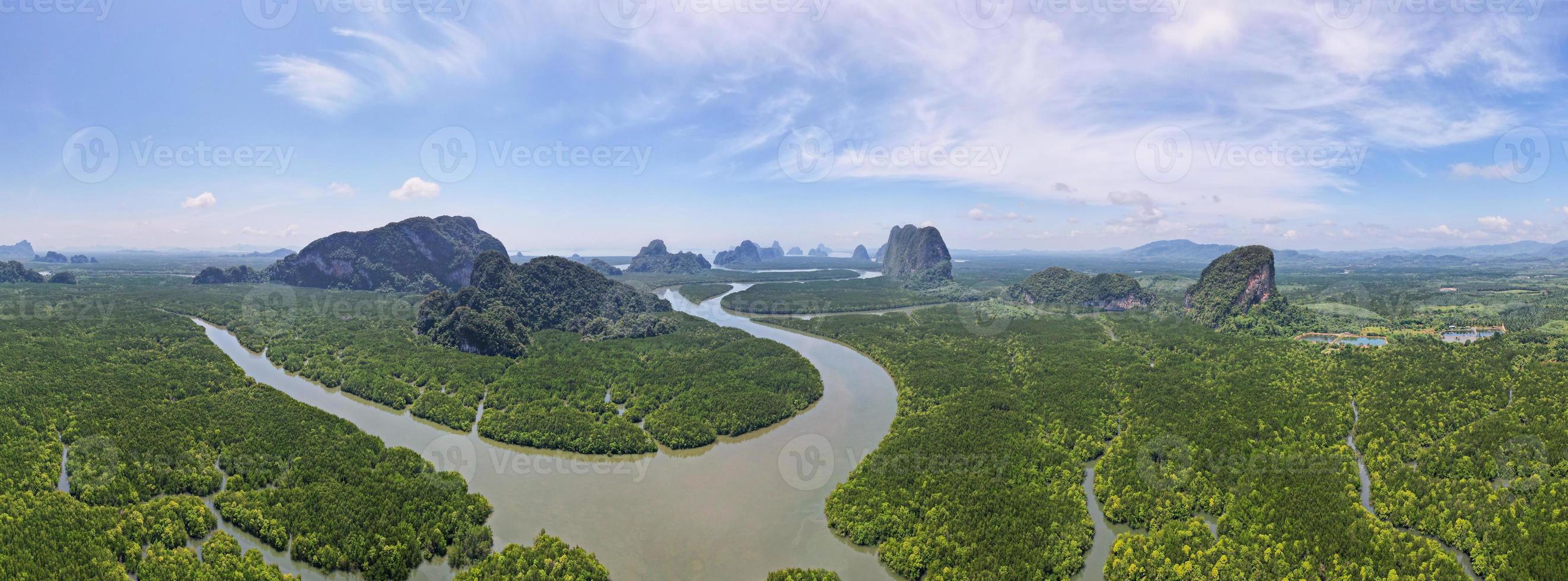 Aerial view drone shot of beautiful nature landscape forest in the morning Drone flying over sea and mangrove forest Landscape High angle view. Dynamic aerial shot Amazing nature panorama view photo