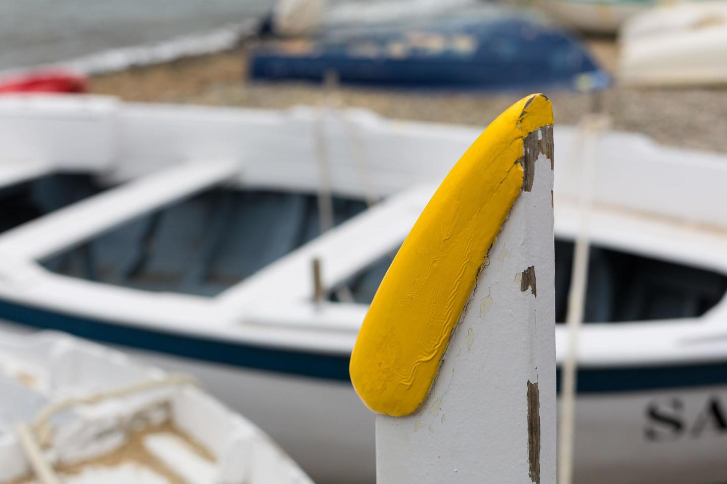 Marine knots on boats with ropes worn by water and sunlight photo