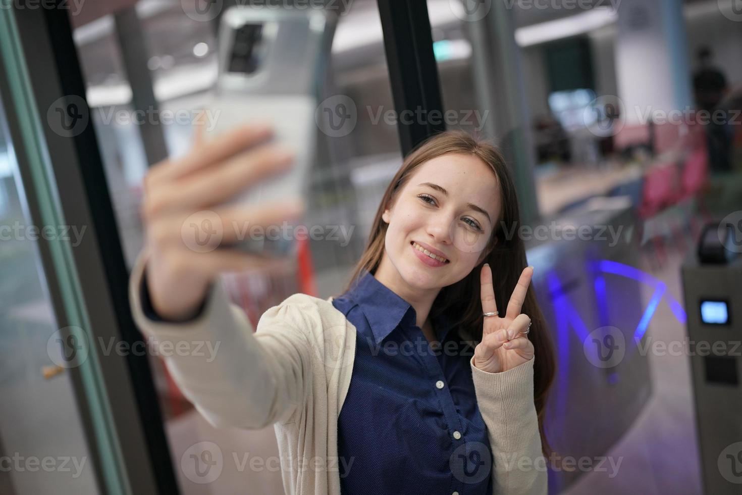 Young attractive female using a mobile phone for social media and using new online 5G technology app photo