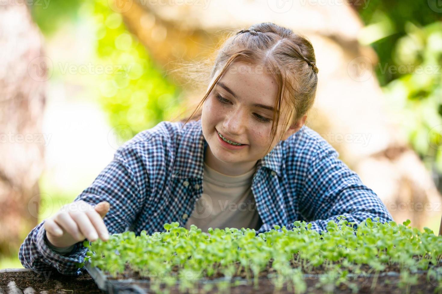 A young diverse group having fun and enjoy emotion in plantation organic's farm greenhouse. photo