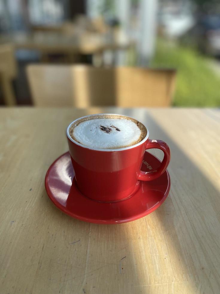 Hot coffee cup on table photo