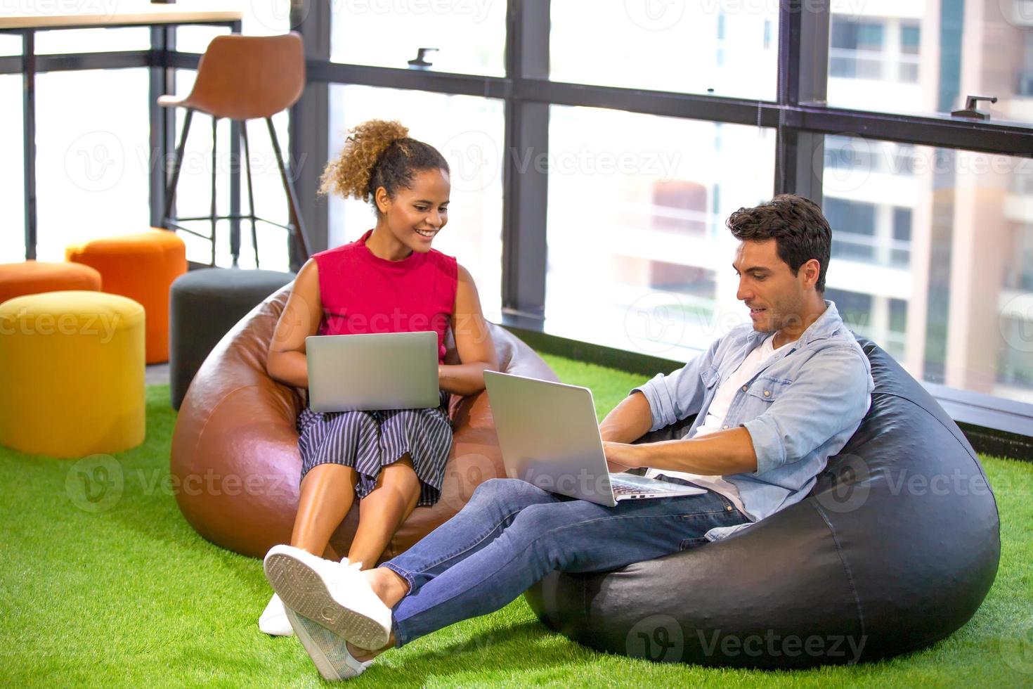 Multiracial business people working on new project marketing plan, meeting inside the modern office. photo