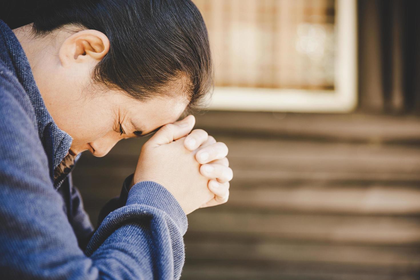 Woman hands praying to god photo
