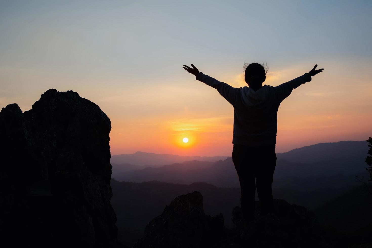 woman worship on sunset photo