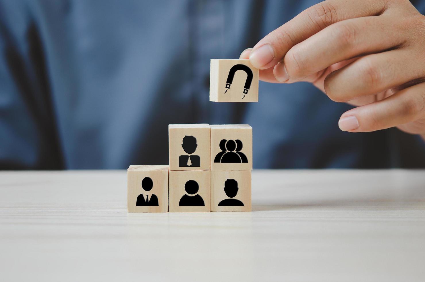 Hand put wooden cubes with Inbound marketing icons and symbols on table and copy space.Business concepts. photo