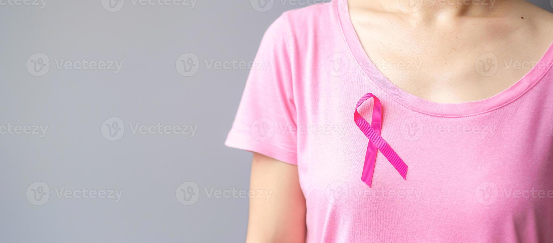 October Breast Cancer Awareness month, elderly Woman in pink T- shirt with Pink Ribbon for supporting people living and illness. International Women, Mother and World cancer day concept photo