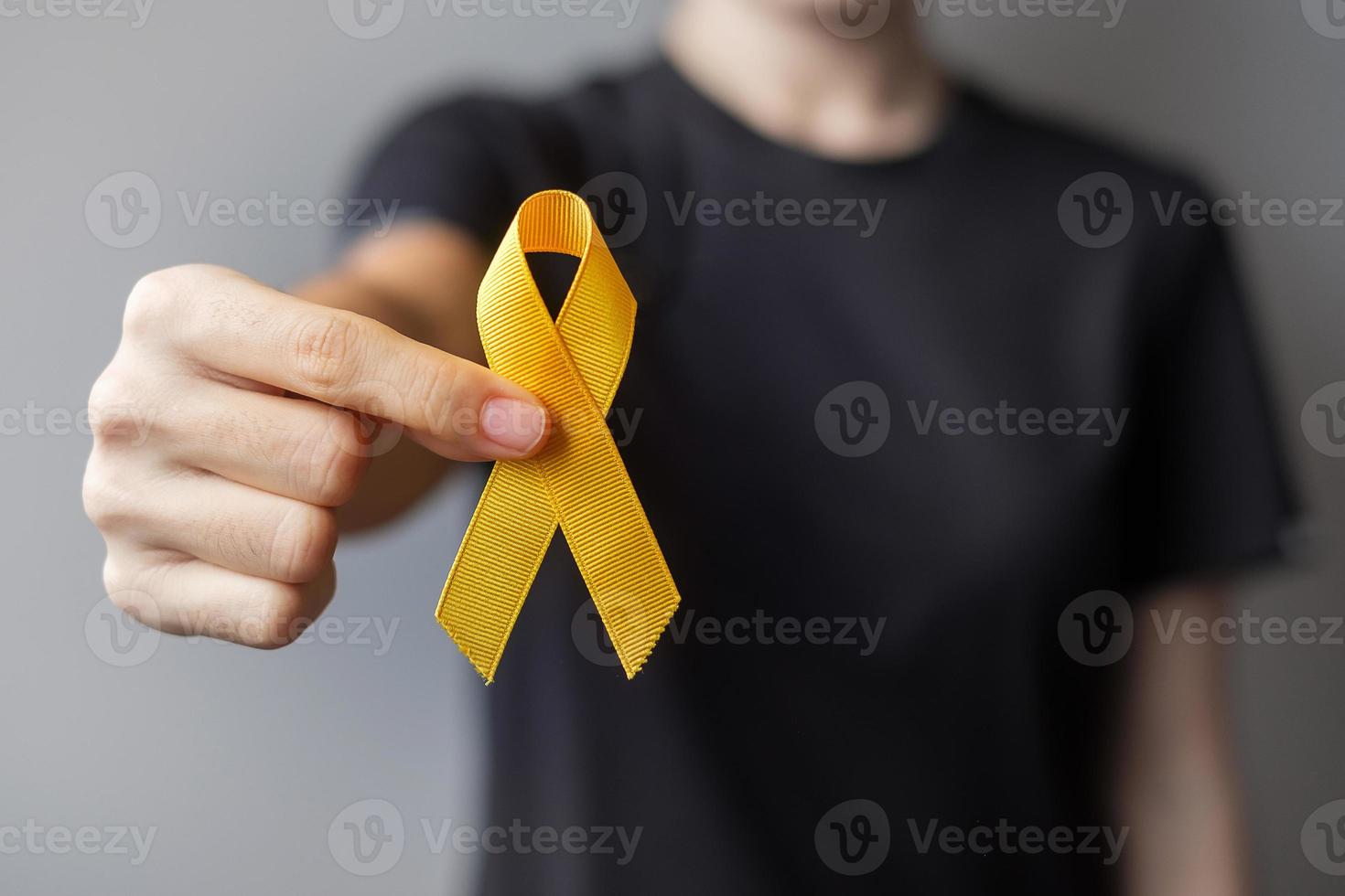Suicide prevention day, Sarcoma, bone, bladder and Childhood cancer Awareness month, Yellow Ribbon for supporting people living and illness. children Healthcare and World cancer day concept photo