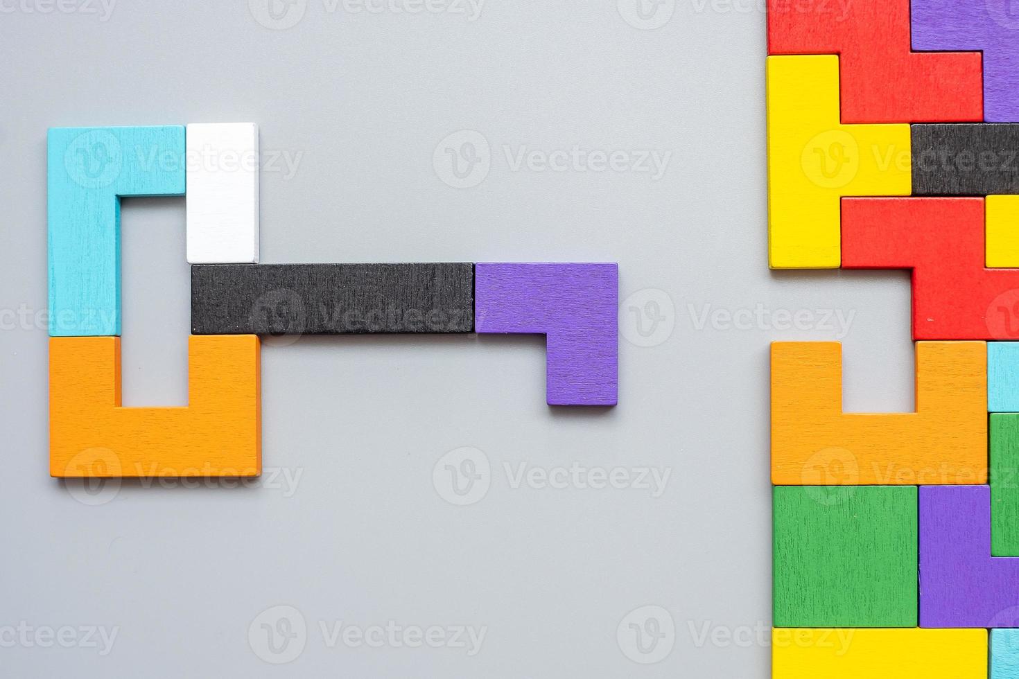 Key and keyhole shape of geometric colorful wood puzzle pieces. logical thinking, business logic, Conundrum, decision, solutions, rational, mission, success, goals and strategy concepts photo