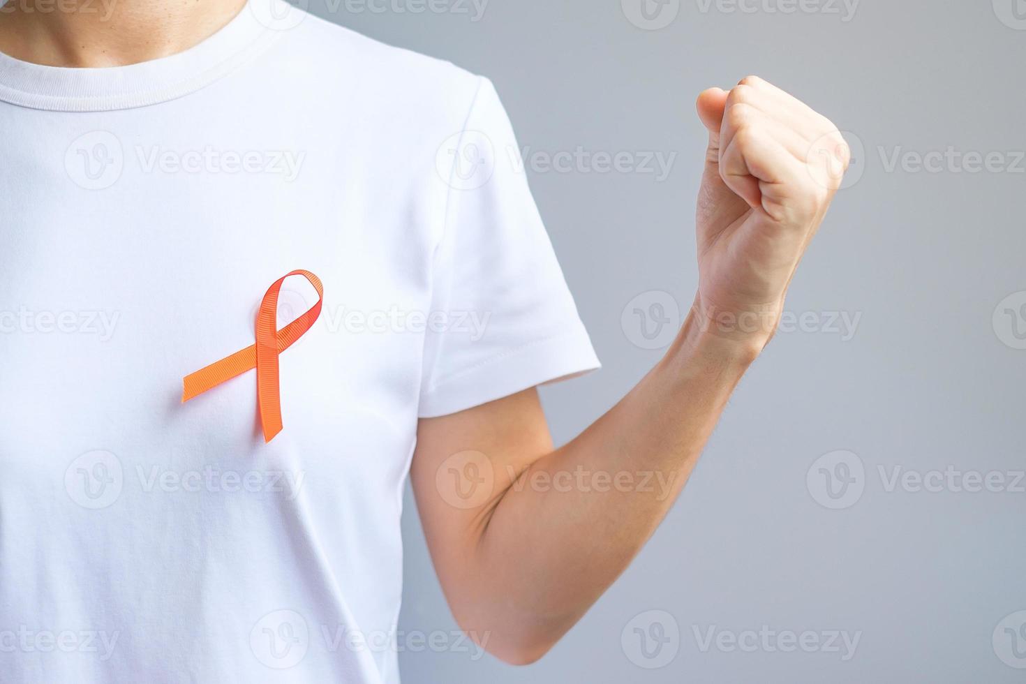 Orange Ribbon for Leukemia, Kidney cancer day, world Multiple Sclerosis, CRPS, Self Injury Awareness month. Healthcare and word cancer day concept photo