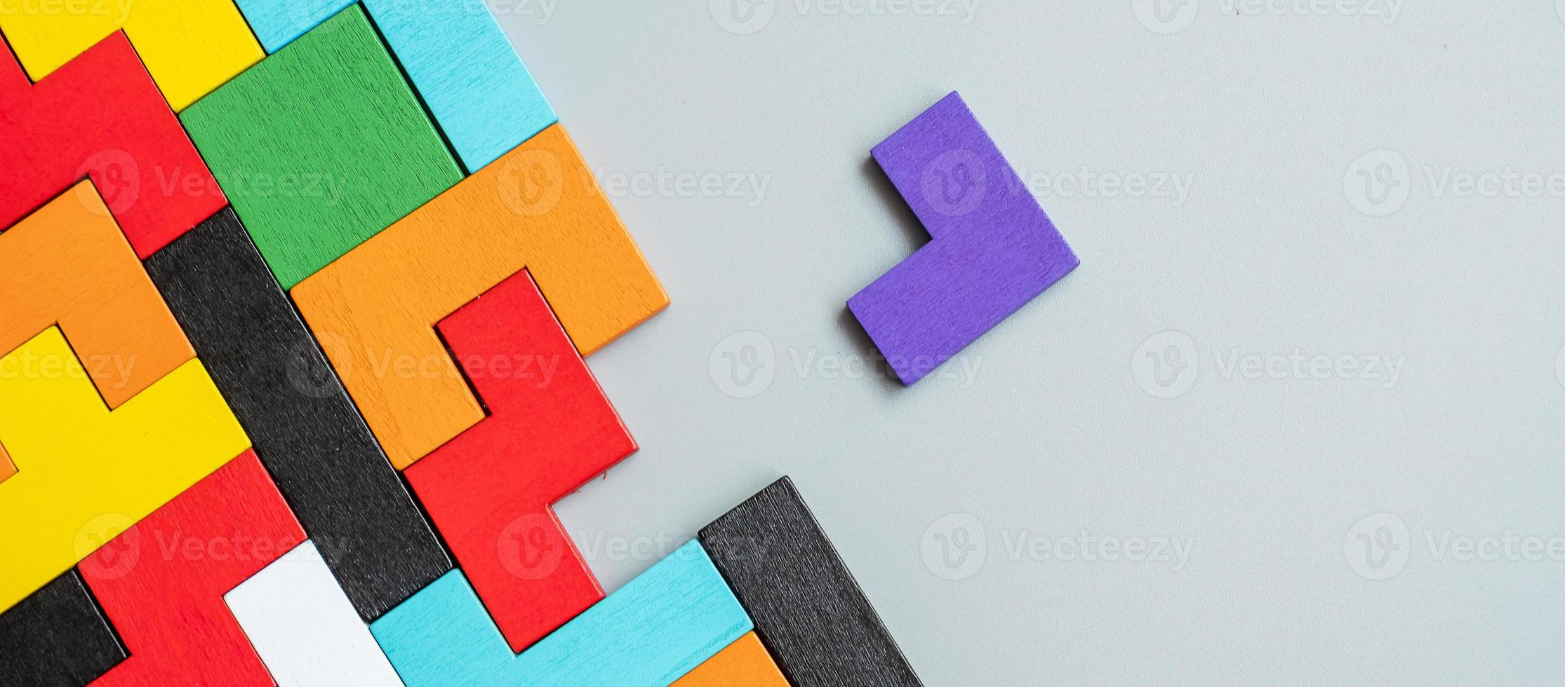 geometric shape block with colorful wood puzzle piece background. logical thinking, business logic, Conundrum, decision, solutions, rational, mission, success, goals and strategy concepts photo