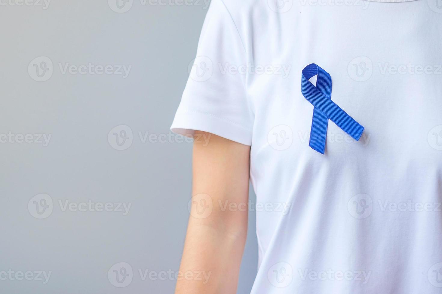 March Colorectal Cancer Awareness month,  dark Blue Ribbon for supporting people living and illness. Healthcare, hope and World cancer day concept photo