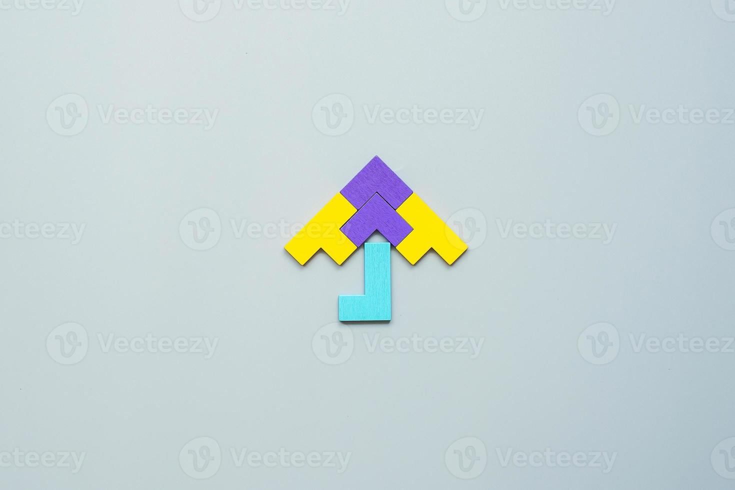 Umbrella shape block of colorful wood puzzle piece on gray background. logical thinking, business logic, Conundrum, decision, solutions, rational, mission, success, goals and strategy concepts photo