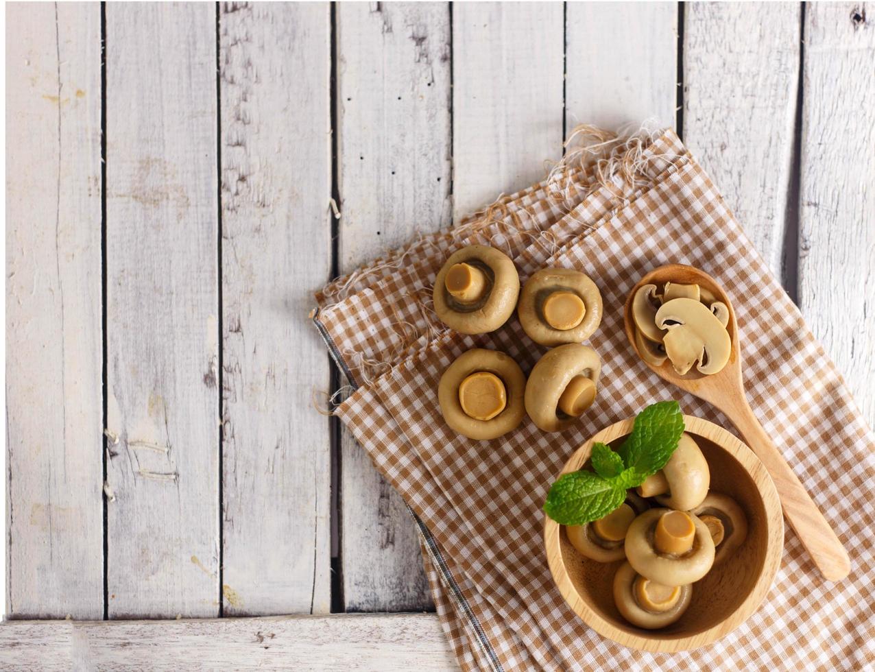 Group of preserve mushroom on wood photo