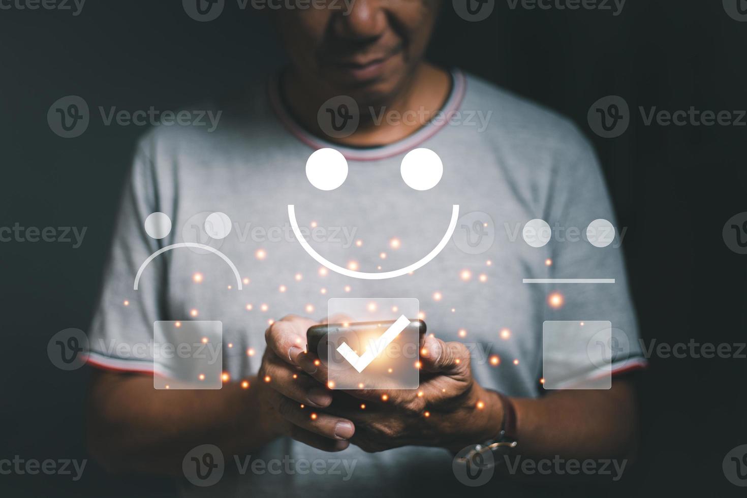 Reviews and Feedback from Customer Experience and presented with an excellent rating of five stars. Along with a smiley face icon on the customer's thumb, satisfaction survey concept and copy space. photo