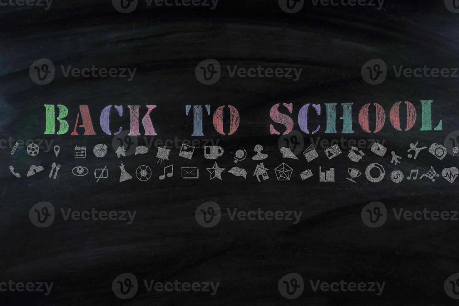 Top view banner message  Back to School  with color pencil Items for the school on  blackboard photo