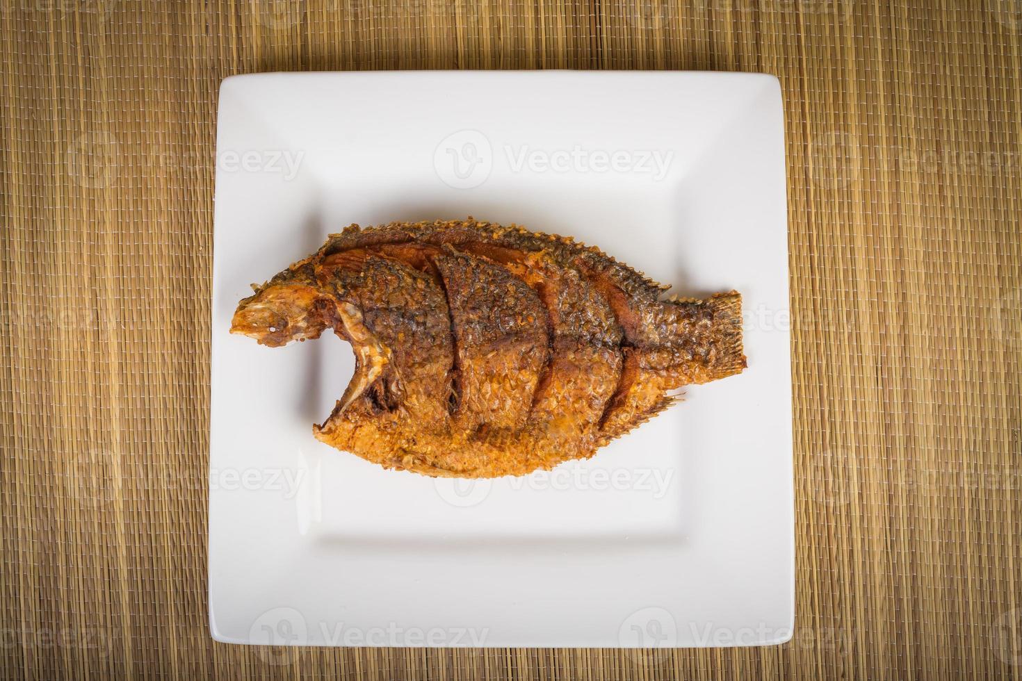 fired fish Thailand food on wooden table photo